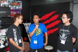 TGS 2012Mad Catz֡ǹԤ줿֥륭СVפΥӥޥå㥤˥󥰥ǥݥvs.ȤࡼӡǺܡDΥå